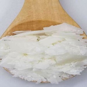 Illipe butter in a wooden spoon