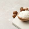 Refined white RBD Shea Butter in wood spoon