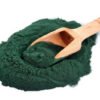 Spirulina Powder with wooden scoop spoon